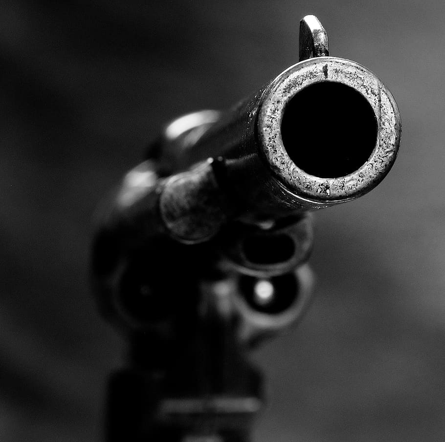 gun, pistol, weapon, rifle, brass, metal, close-up, focus on foreground, single object, indoors