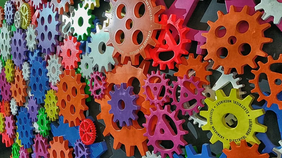 assorted-color sprockets wall decorations, blue, colors, gear, industrial, industry, orange, purple, red, yellow