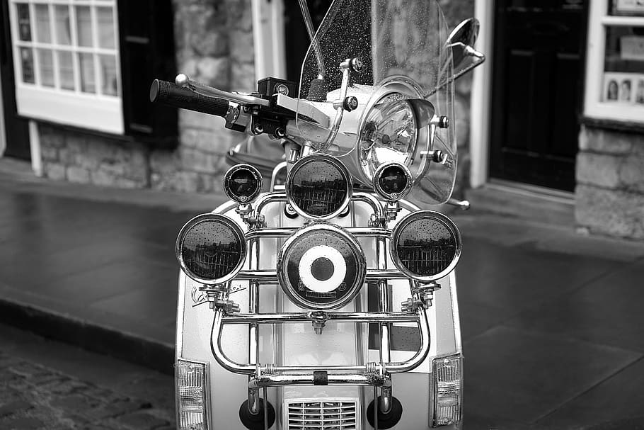 grayscale photo, parked, motorcycle, scooter, 1960s, retro, vehicle, italian, transport, old