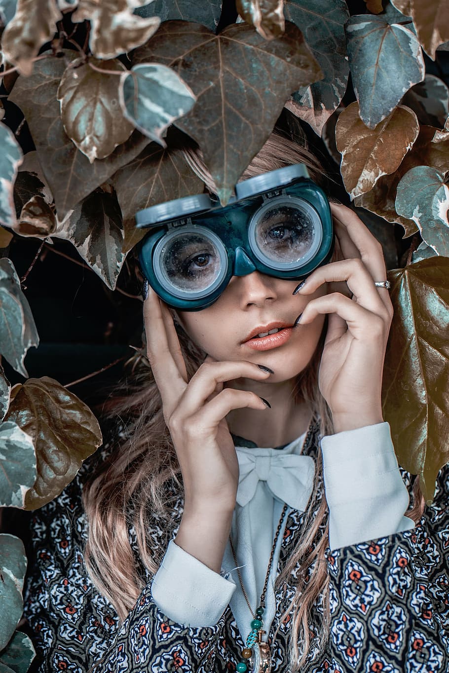 woman, wearing, goggles, hiding, behind, leaves, nature, plants, people, lady