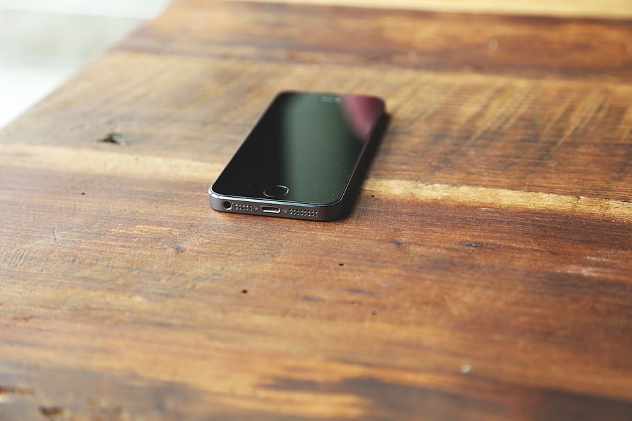 iphone, cell phone, mobile, technology, wood - material, table, indoors, still life, close-up, selective focus