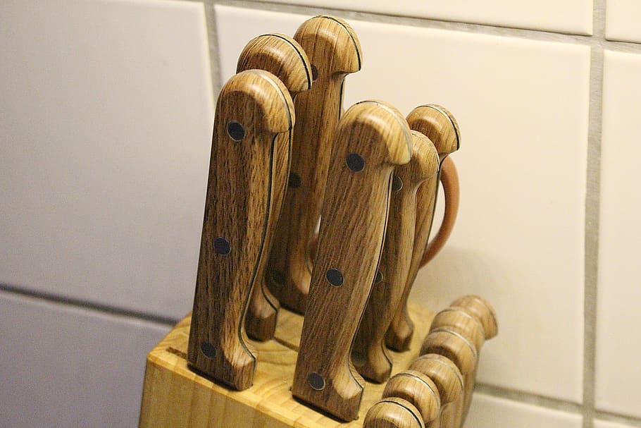 knife block, knife, handle, wooden handle, wood - material, indoors, focus on foreground, music, close-up, metal