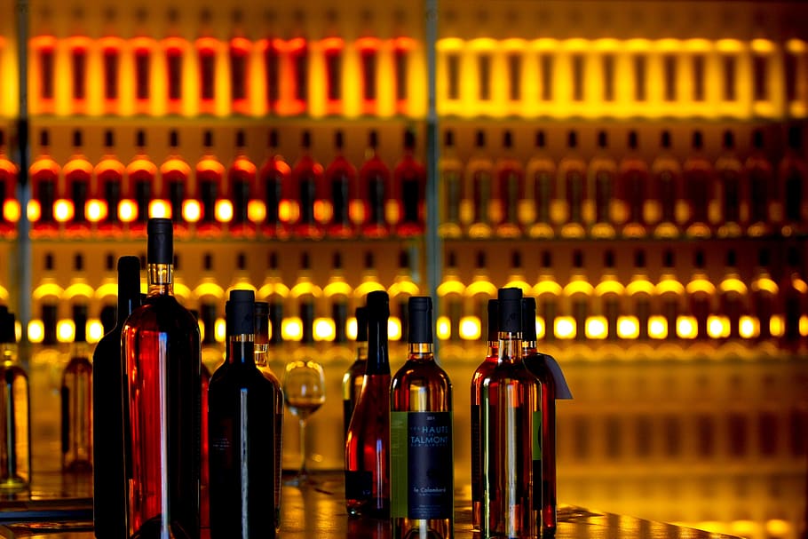 liquor bottles, rack, wines, bottles, orange, drink, alcohol, wine shop, red wine, shop