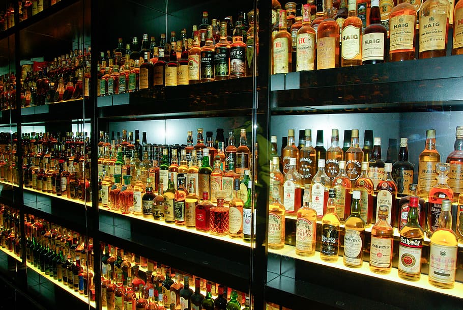 assorted-wine bottle, shelf, whisky, alcohol, bottles, choice, retail, arrangement, large group of objects, indoors