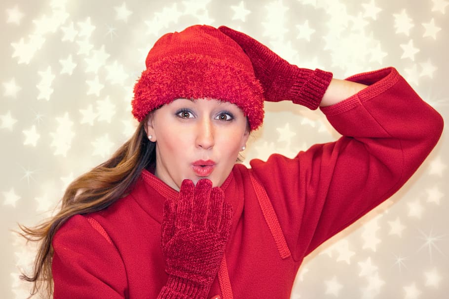 woman, wearing, red, sweatshirt, hat, blowing kiss, cold, winter, christmas, xmas
