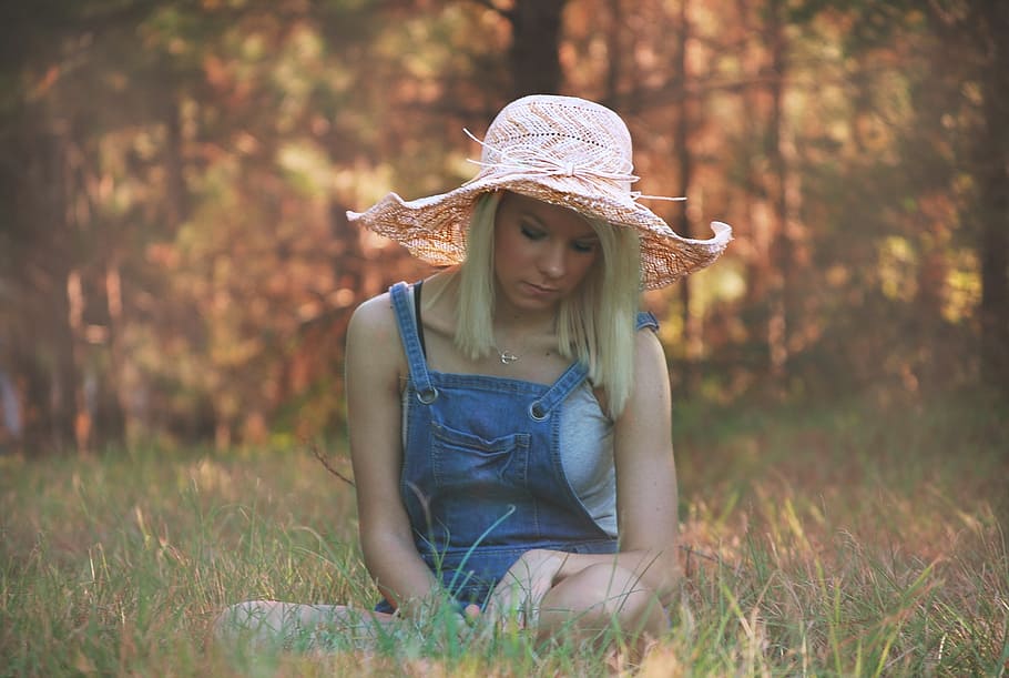 woman, wearing, pink, beach hat, sitting, green, grass, girl, summer, young