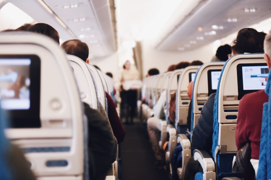 people, sitting, airplane chairs, indoor, airplane, airline, passengers, cabin, group of people, transportation