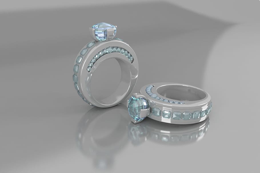 two, silver-colored teal crystal, encrusted, rings, ring, gemstone, diamonds, studio shot, indoors, reflection