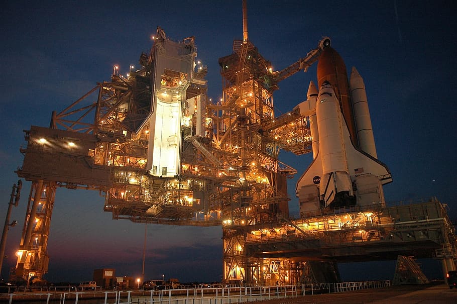 white, red, rocketship, discovery space shuttle, rollout, launch pad, pre-launch, astronaut, mission, exploration
