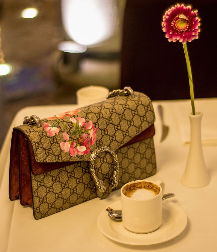 gucci fold-over bag, teacup, saucer, coffee, cappuccino, breakfast table, pocketbook, flower, elegant, drink