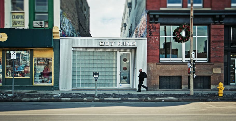 2017 king stall, man, walking, pass, white, king, building, daytime, architecture, infrastructure