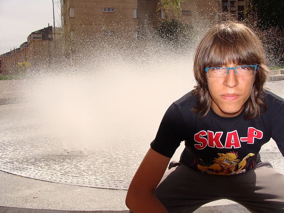 man, sitting, water fountain, focus photo, guy, teenager, young, portrait, person, teen