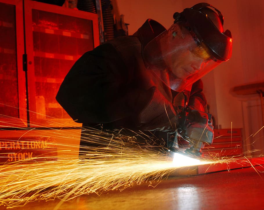 person, wearing, black, jacket, holding, power tool, man, working, metal worker, tool
