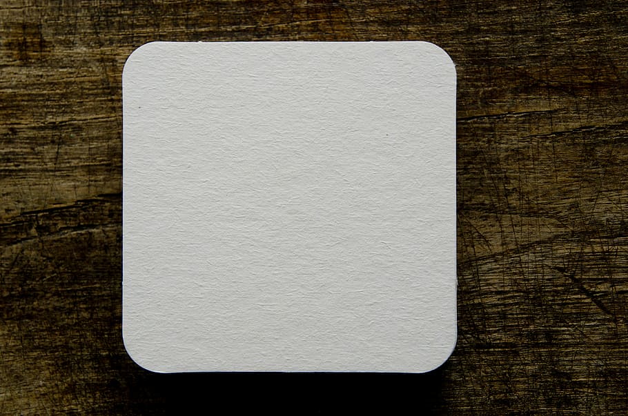 square white trinket, beer coasters, blank, drink, table, paper, pulpboard, rounded, mockup, wood