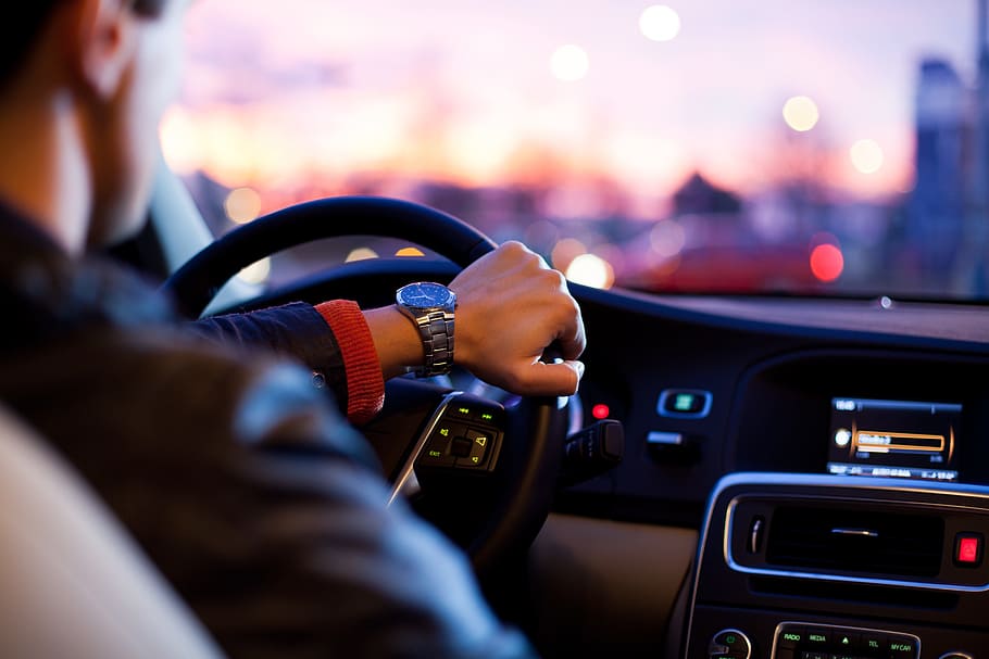 man, black, jacket, holding, steering wheel, driver, car, traffic, hurry, dusk