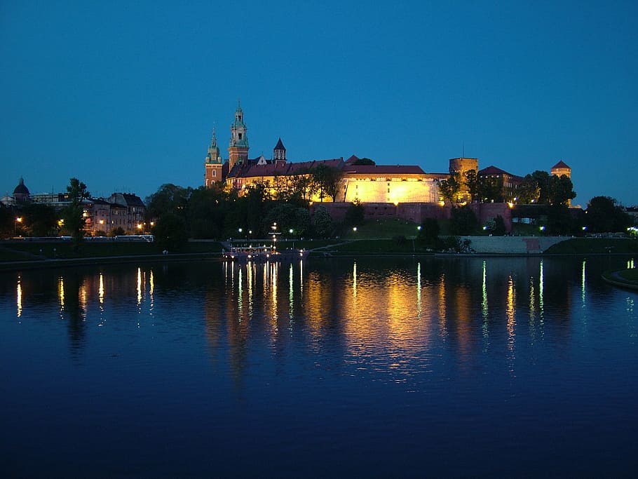 lighted, brown, castle, calm, body, water, poland, krakow, night, city
