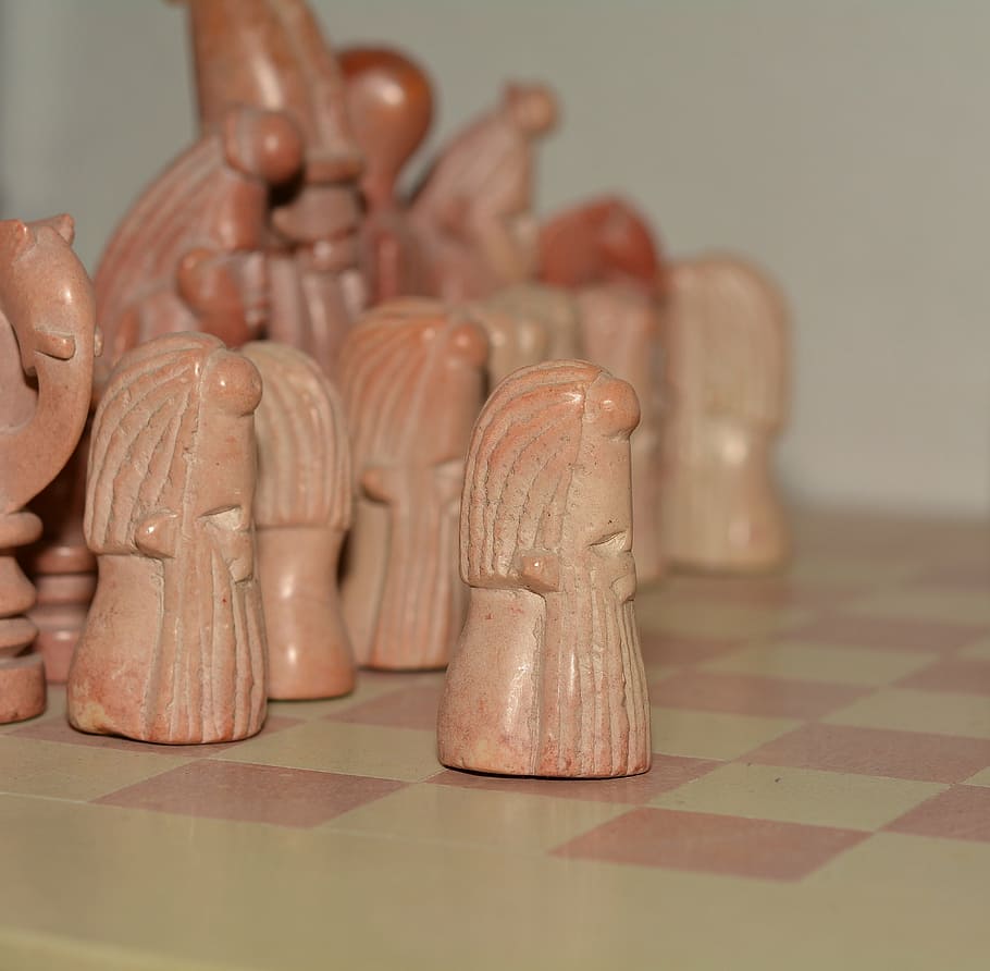 chess pieces, stone, chess game, close, indoors, close-up, art and craft, focus on foreground, still life, table