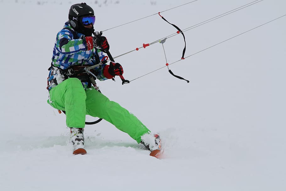 person skiing, snow, holding, harness, kite, kitesurfing, winter, sports, extreme, skiing