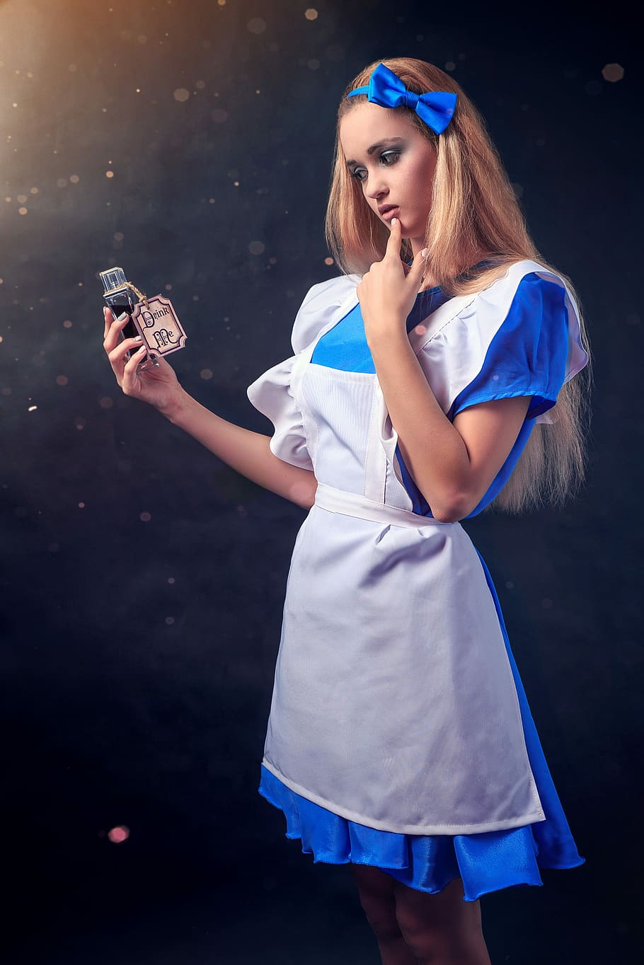 woman, wearing, alice, wonderland dress, holding, glass bottle, young, girl, lovely, charm