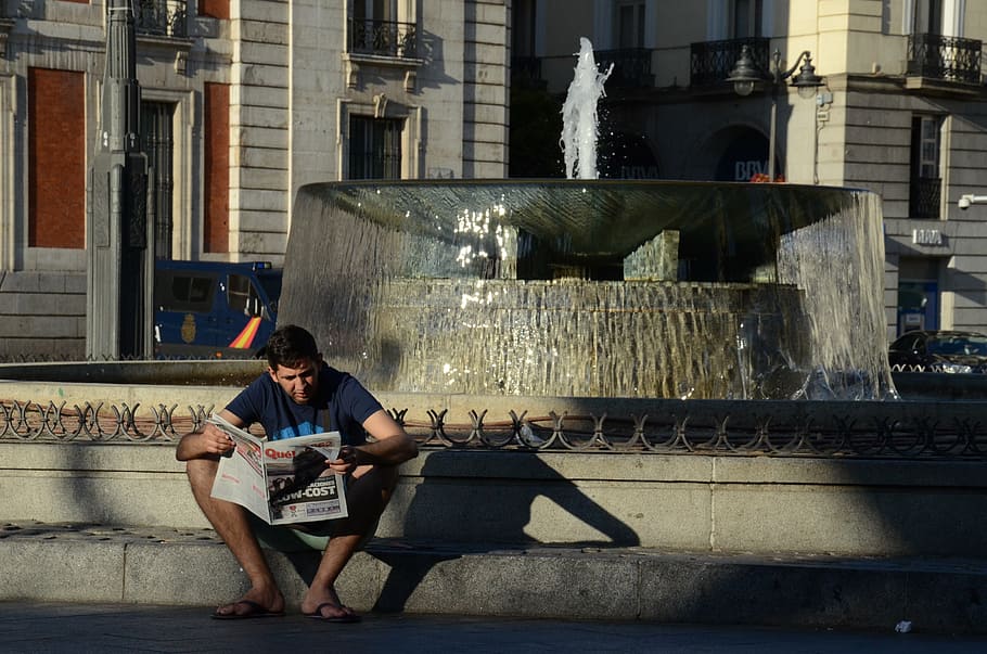boy reading newspaper, newspaper, reading, read, information, man reading, madrid, spain, square, read in the square