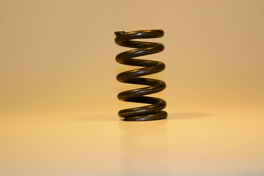black coil spring, abstract, blur, close-up, conceptual, focus, spiral, still life, studio shot, indoors