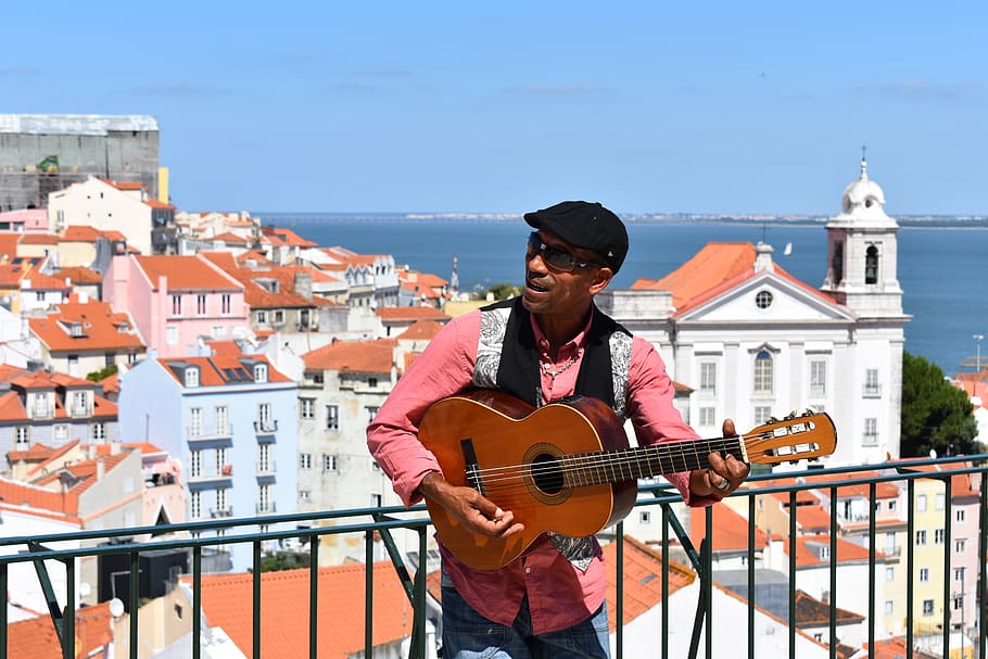alfama, lisbon, portugal, europe, travel, sea, view, guitar, guitarist, street performer