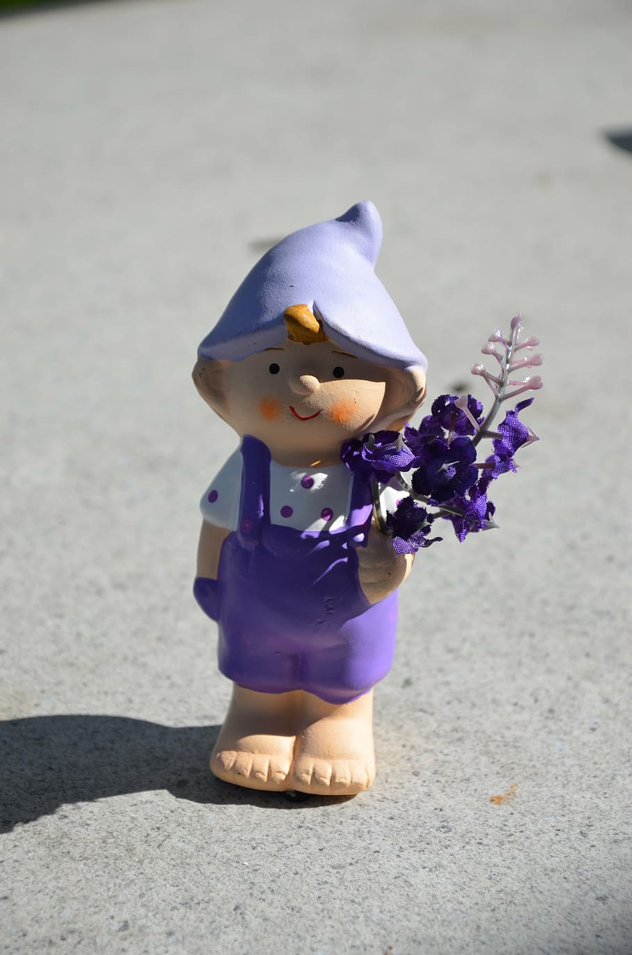 garden gnome, violet, overalls, flowers in the hand, dwarf, representation, toy, childhood, human representation, day