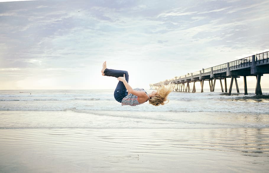 woman, back, flipping, seashore, blonde, haired, gray, top, blue, jeans