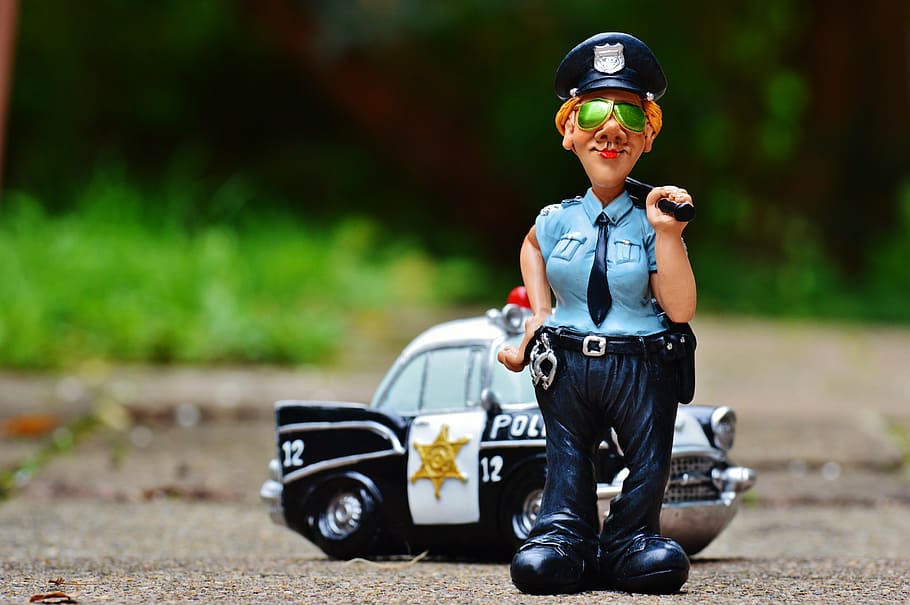 policewoman figurine, standing, police vehicle toy, policewoman, police, police car, figure, funny, fun, handcuffs