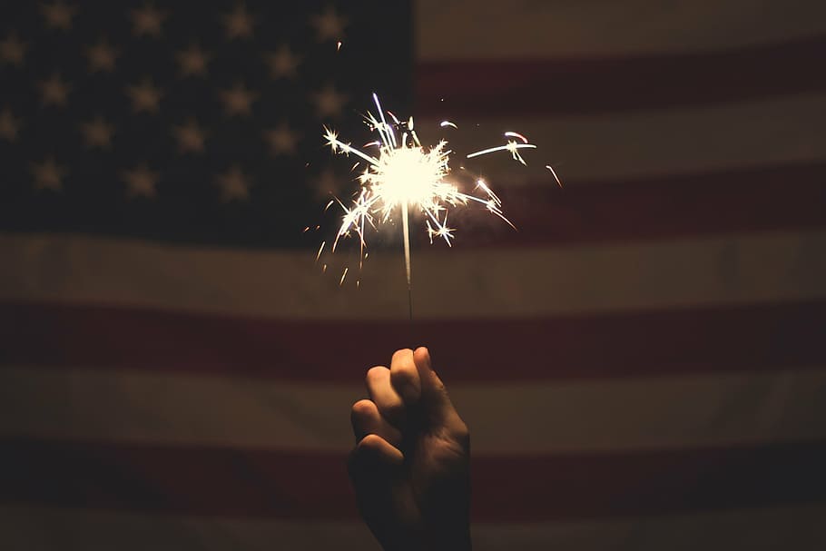 person holding sparkle, firecracker, american flag, july, fourth, 4th, independence, usa, banner, national