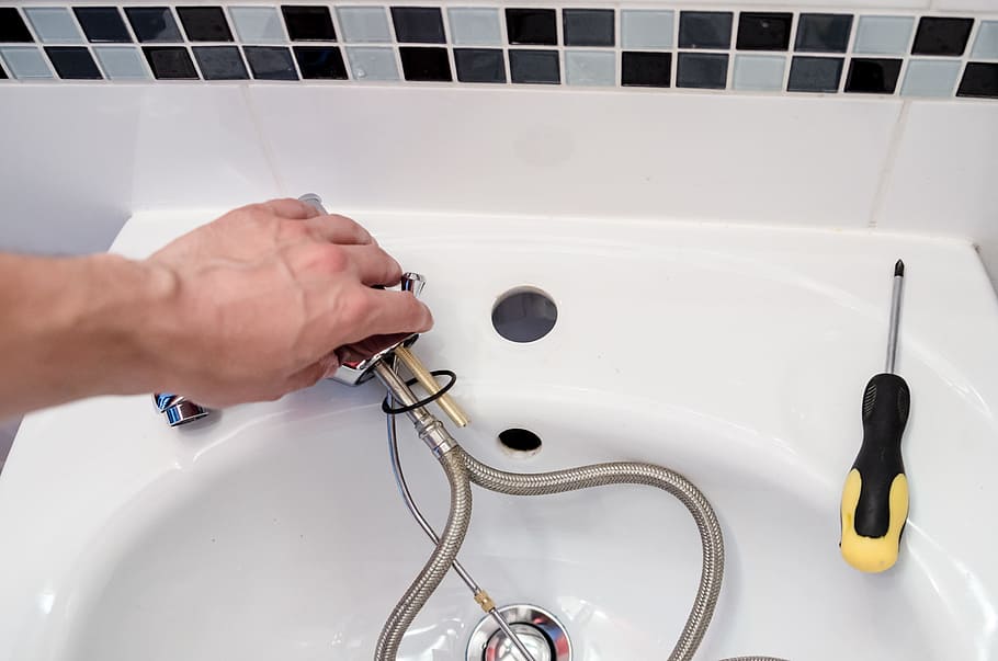 person, holding, gray, stainless, steel faucet, plumber, repair, faucet, battery, hydraulics