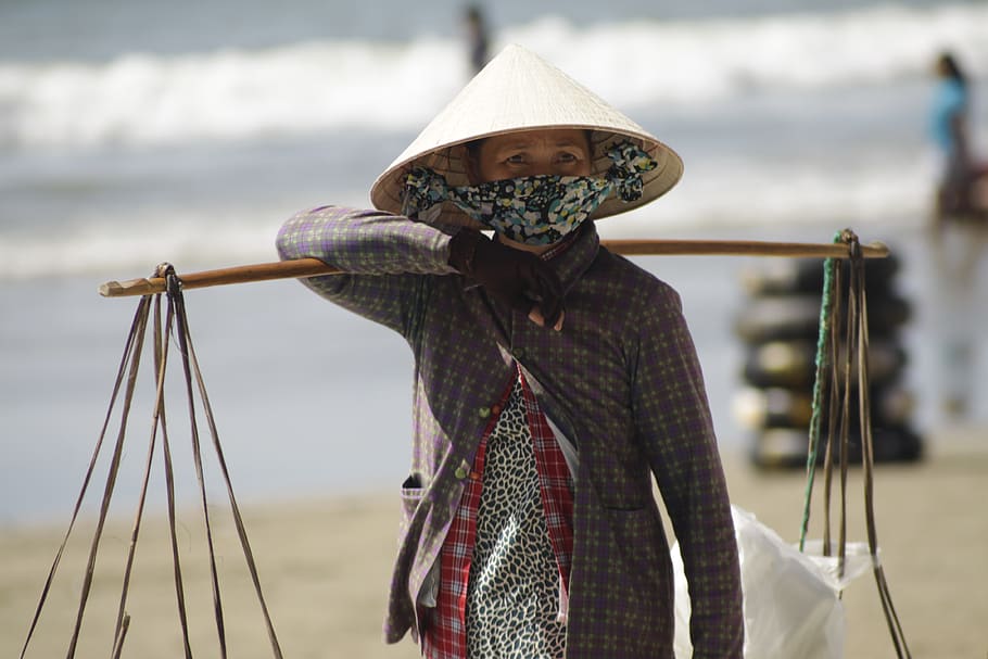 hat, seaside, badger, street vendor, resort, lifestyle, woman, one person, focus on foreground, clothing