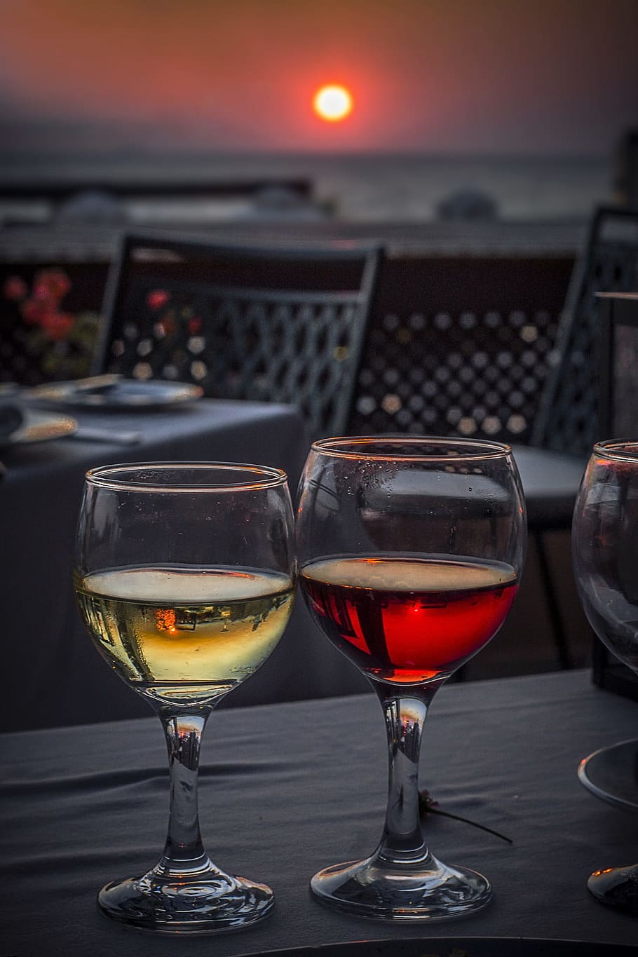 two, clear, wine glasses, filled, red, yellow, liquids, wine, glass, sunset