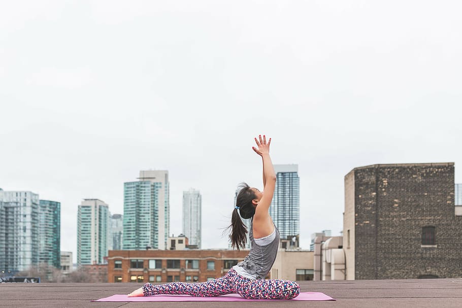 woman doing yoga, architecture, building, infrastructure, outdoor, rooftop, people, woman, exercise, stretching