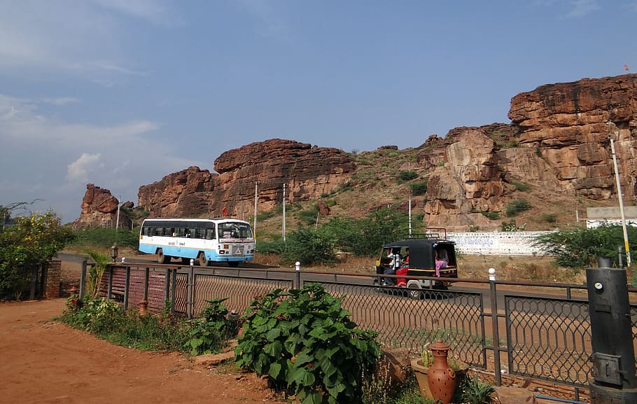 badami, rocks, sand stone, red, cliff, road, bus, india, mountain, transportation