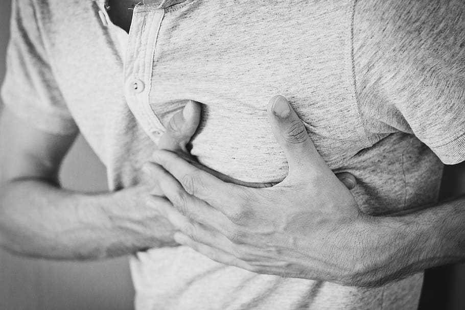 man, holding, chest grayscale photo, adult, affection, chest, chest pain, cotton shirt, hands, heartache