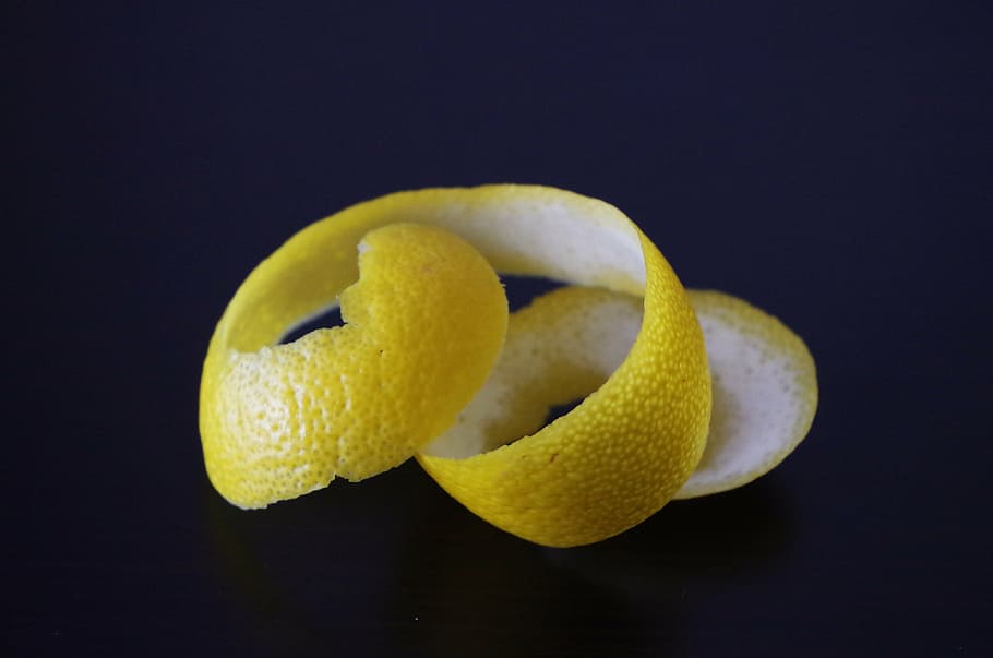 lemon skin, lemon, lemon peel, peeled citrus, studio shot, fruit, black background, yellow, single object, indoors