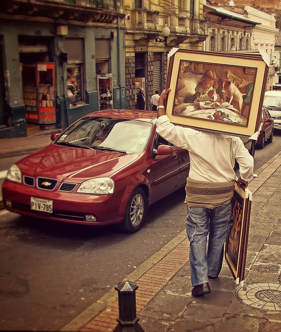 person, holding, paintings, walking, sidewalk, quito, streets, ecuador, man, painting