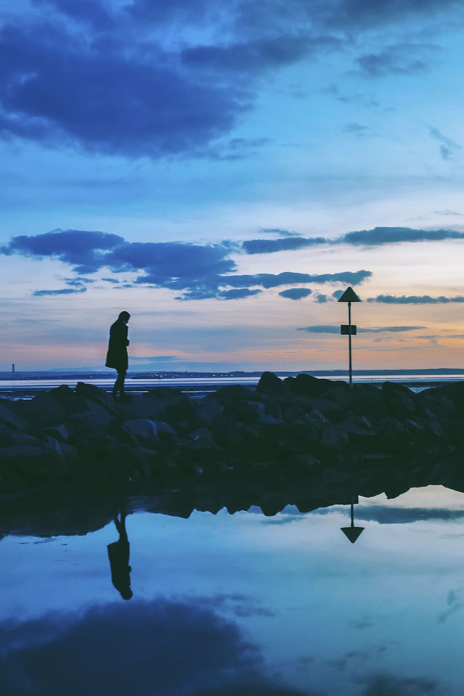 silhouette photo, person, standing, rock, sea, ocean, water, rocks, people, travel