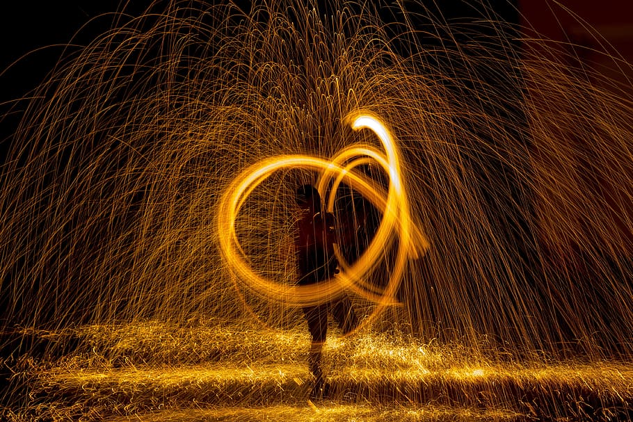 steel wall photography, person dancing, nighttime, fire, radio, night, show, steel wool, light, fireworks