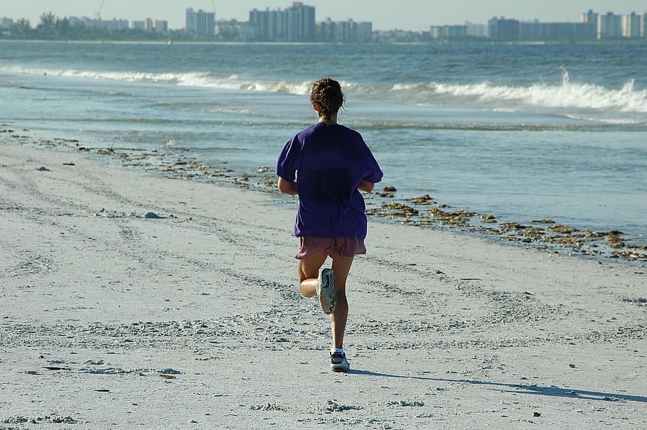 person, blue, top, red, shorts, standing, body, water, daytime, woman jogger