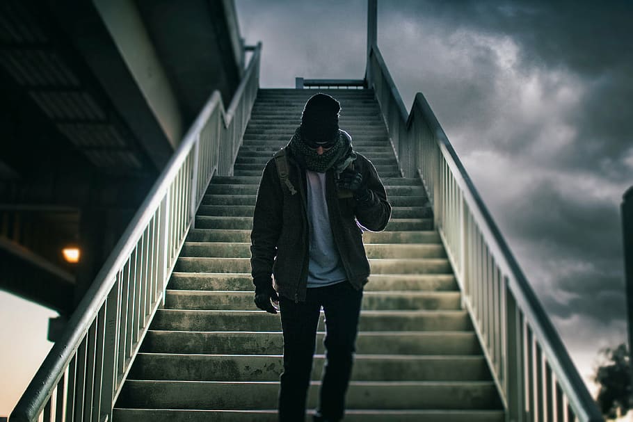 man, standing, middle, stair case, walking, concrete, stairs, cloudy, sky, clouds