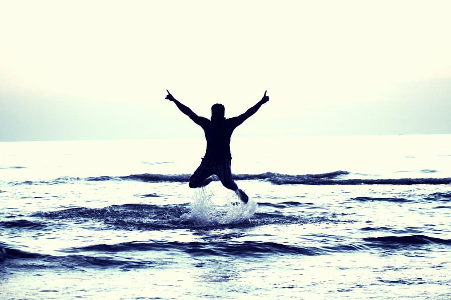 man jump, sea, daytime, boy flying happy boy, amazing boy, awesome, happiness, flying, happy, amazed
