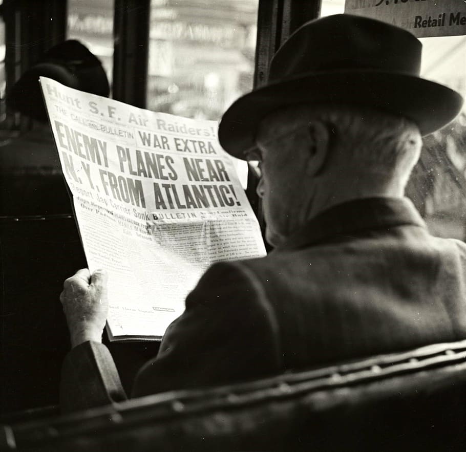 grayscale photography, man reading newspaper, man, newspaper, hat, bus, reading, vintage, street, 1930's