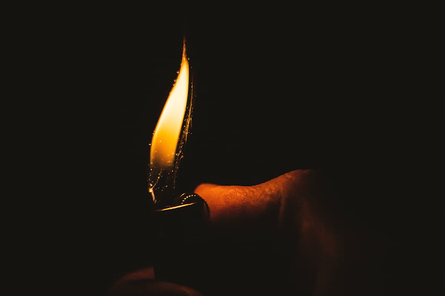 person, holds, lighted, lighter, fire, light, warm, burn, flame, kindle