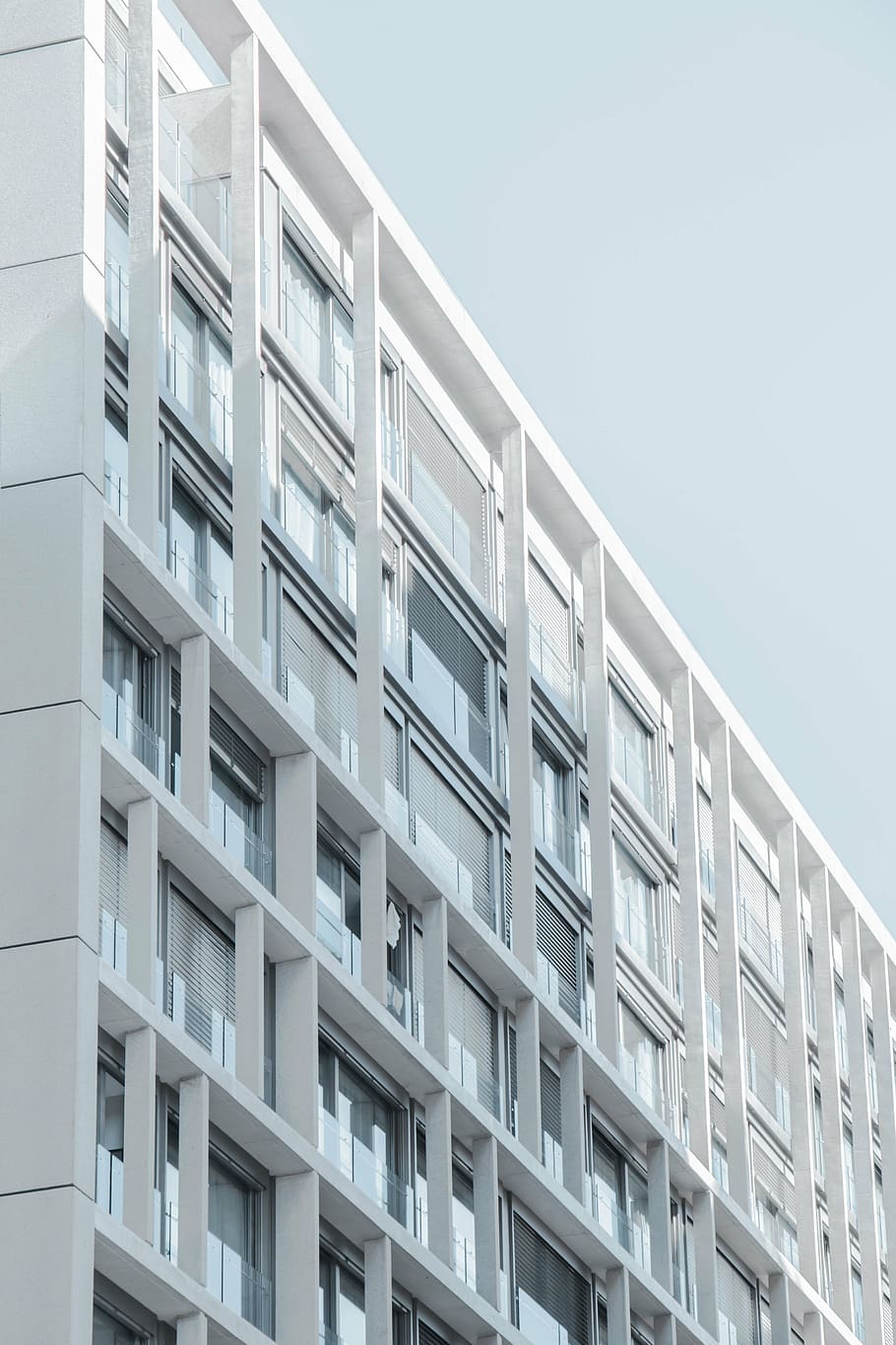 low-angle photography, white, high-rise, building, concrete, day, architecture, infrastructure, sky, facade