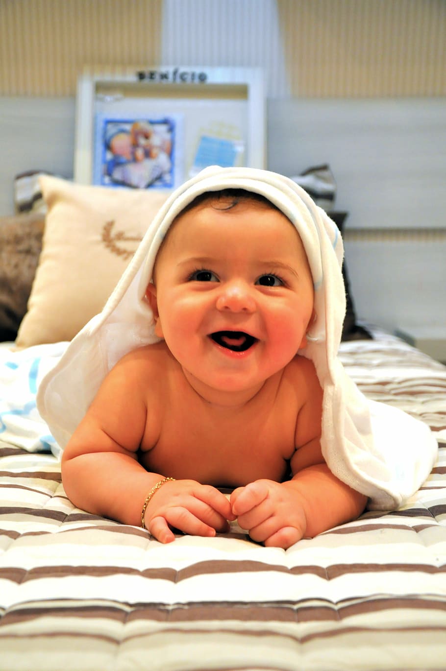 baby, lying, brown, white, stripe comforter, smiling, bebe, child, after the bath, smile