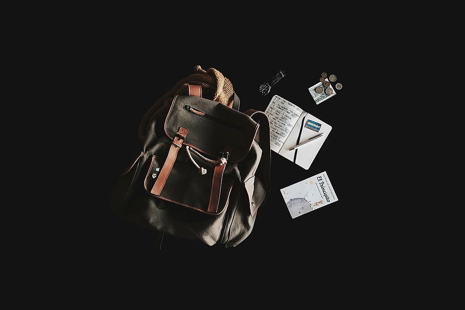 bucket bag, notebook, pen, top, backpack, book, money, travel bag, wristwatch, black background