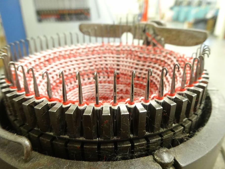 old knitting machine, knitting machine, close-up dial, focus on foreground, close-up, indoors, red, in a row, education, research