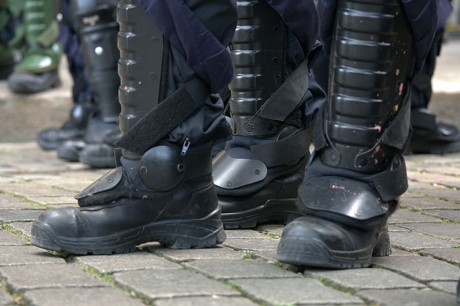 black, leather combat boots, gray, concrete, pavement, technology, demonstration, police, boots, dispute